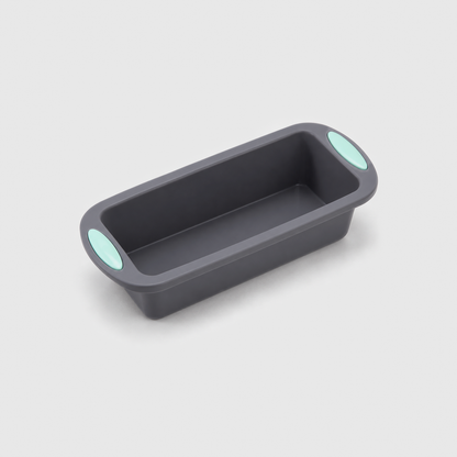 Gray silicone loaf pan with a mint-green pad on each end tab, on a light gray background