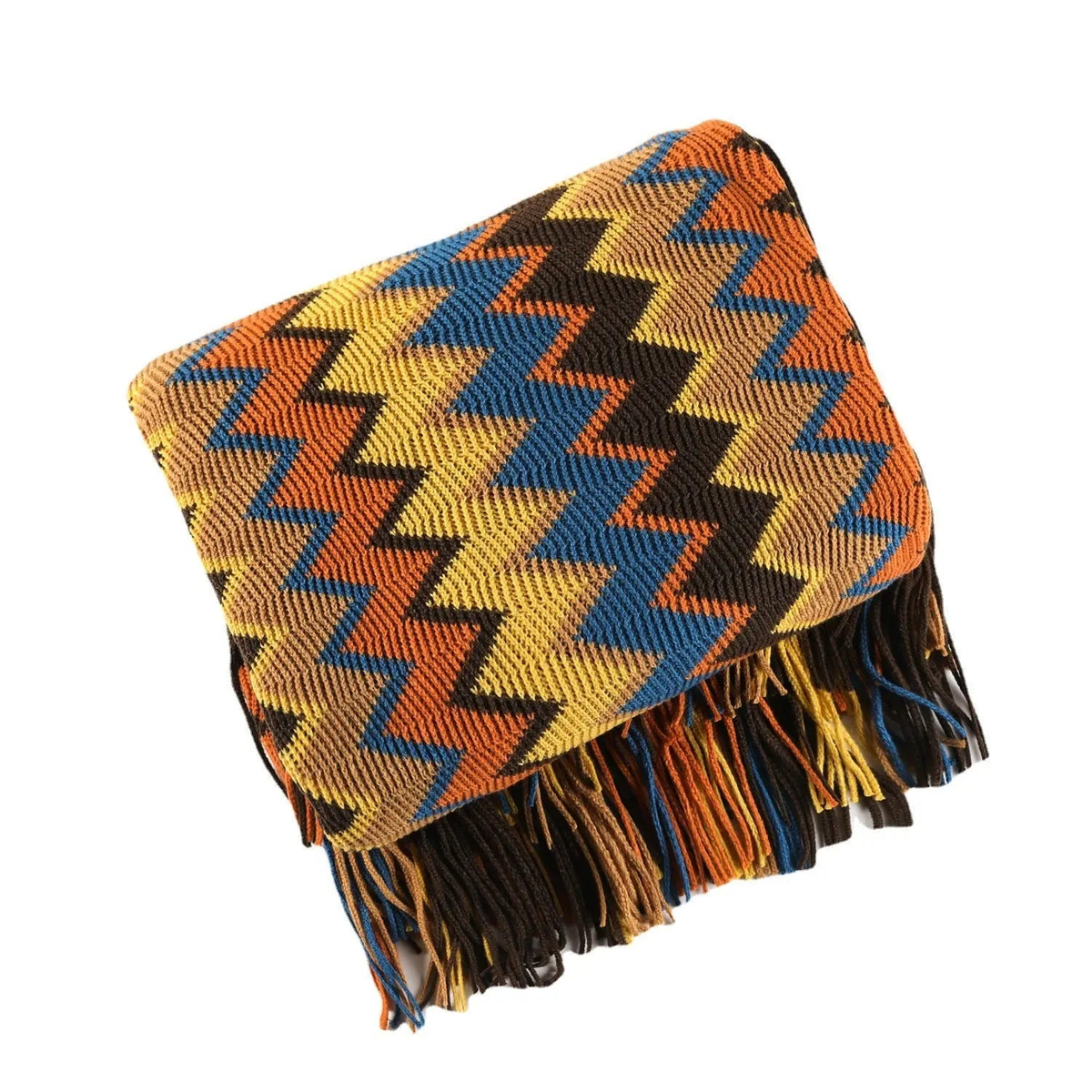 A chevron knit throw in orange, mustard, blue and dark brown, folded square on a white background with its tassel fringe hanging down.