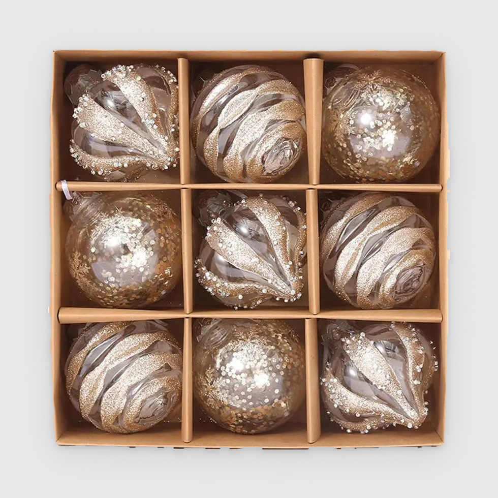 Box of 9 clear Christmas baubles with champagne glitter in droplet, swirl and sequin designs