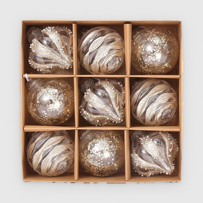 Box of 9 clear Christmas baubles with champagne glitter in droplet, swirl and sequin designs