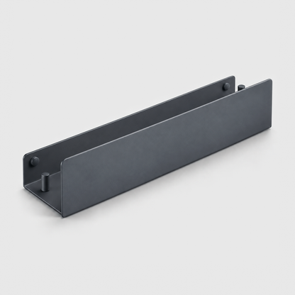 Black aluminum bathroom shelf with a tall front lip, open ends and a hook peg at each end, on a light grey background