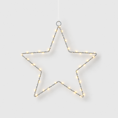 LED star light hanging from its top ring, its warm white beads lit, on a light gray background