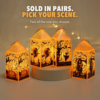 Four mini Halloween lanterns lit on and beside a round plinth, with the words Sold in pairs, pick your scene
