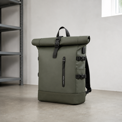 Green roll top backpack on the concrete floor of a daylit utility room beside steel shelving