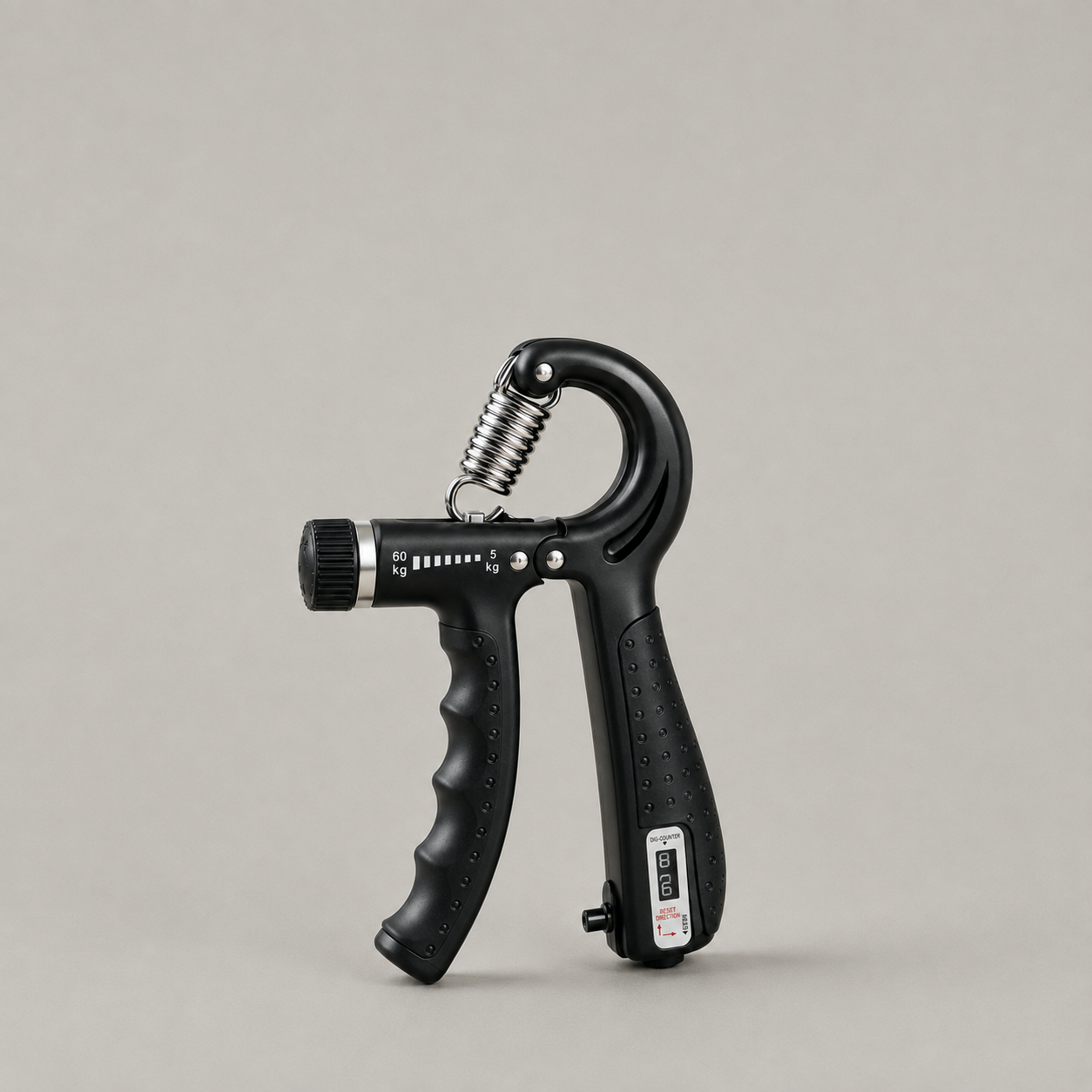 Black adjustable hand gripper with a steel spring and counter panel on a plain grey studio background