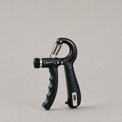 Black adjustable hand gripper with a steel spring and counter panel on a plain grey studio background