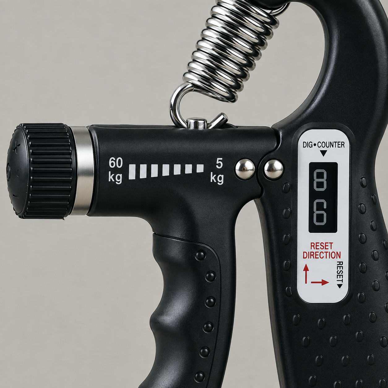 Close view of the hand gripper's tension knob, 60 kg to 5 kg scale and counter panel