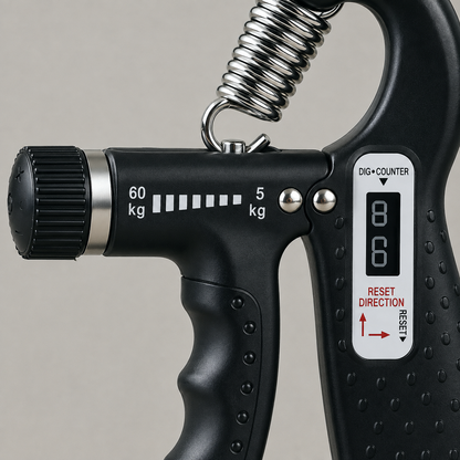 Close view of the hand gripper's tension knob, 60 kg to 5 kg scale and counter panel