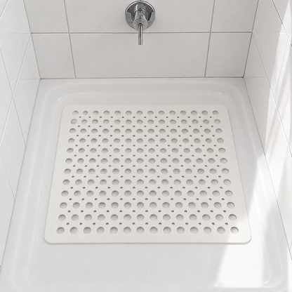White square non slip shower mat with drainage holes in a square shower tray