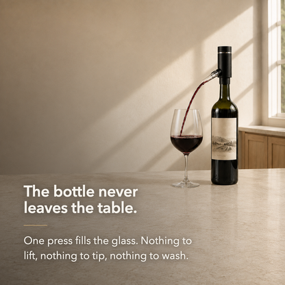 The bottle never leaves the table: the aerator fills a glass from an upright bottle on a kitchen island