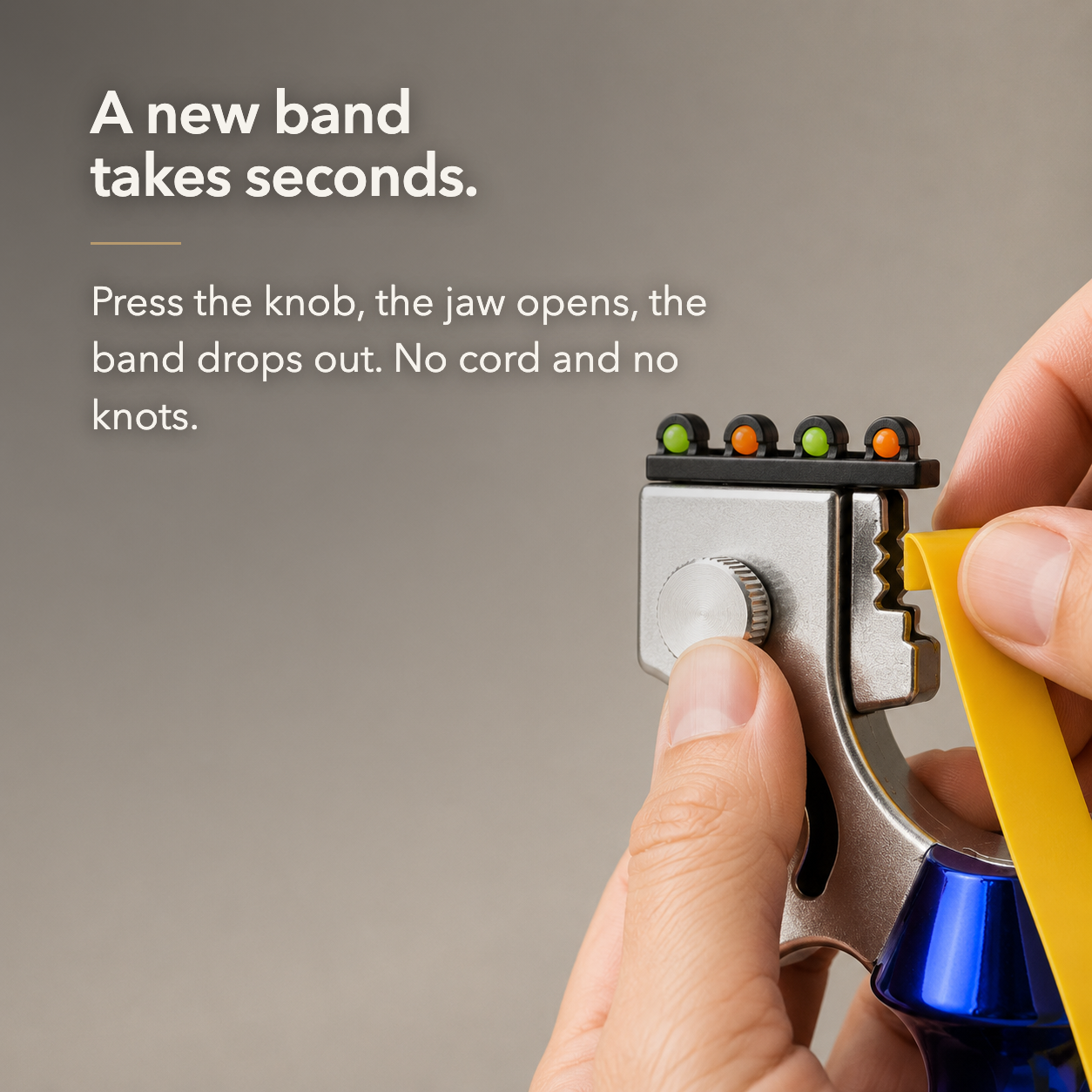 A thumb pressing the knurled knob to open the toothed band clamp and release the flat band