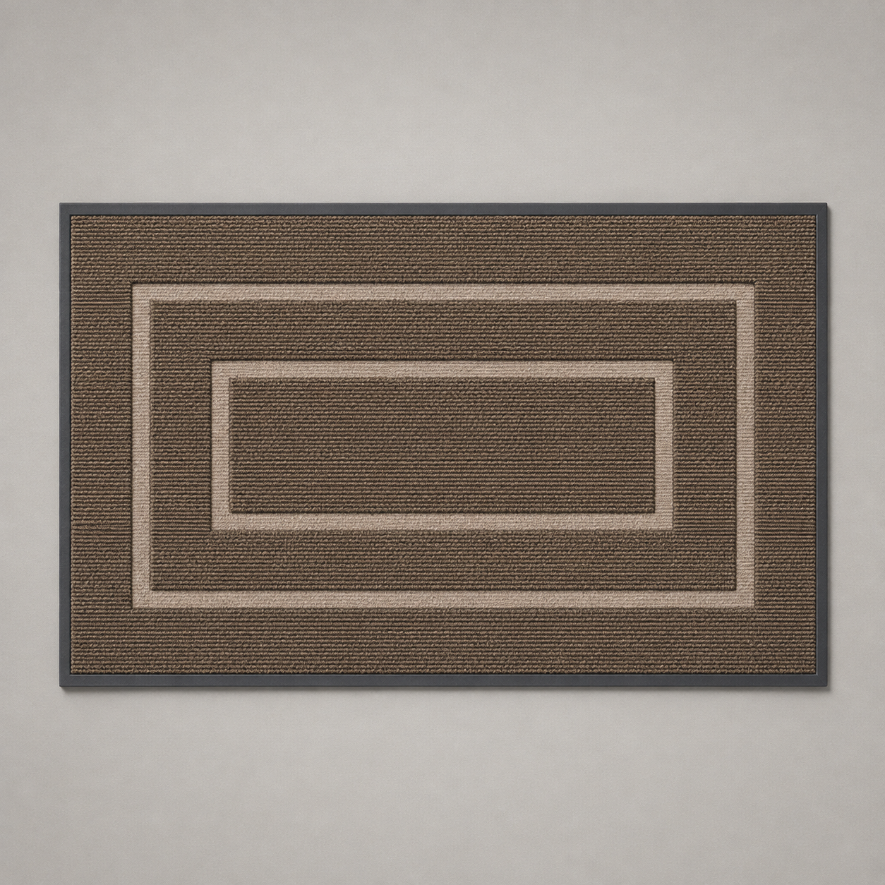 Brown door mat photographed flat from above on a plain gray background, with two pale bands around a plain center panel.