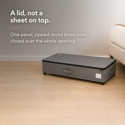 Gray under bed storage box with its single-panel zippered lid closed over the whole opening.
