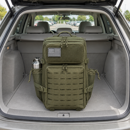 Olive green laser cut MOLLE tactical backpack in an open car boot