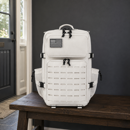 Off white laser cut MOLLE tactical backpack on a dark oak hall bench