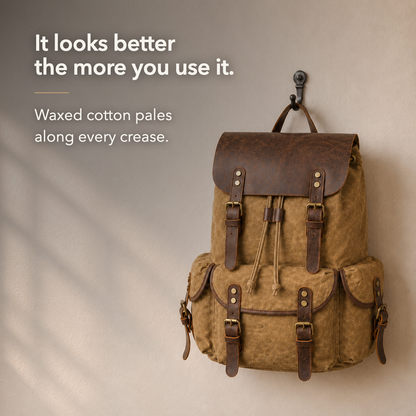 The khaki waxed canvas rucksack hanging on a wall hook, the wax paled along every crease