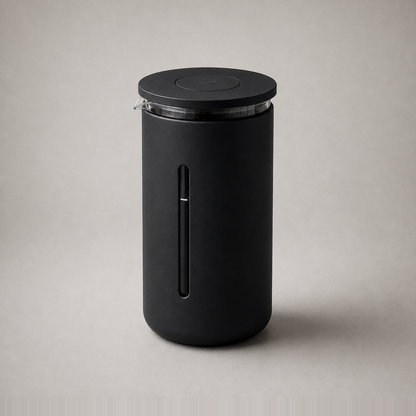 Studio photograph of the black French press coffee maker on a plain grey background.