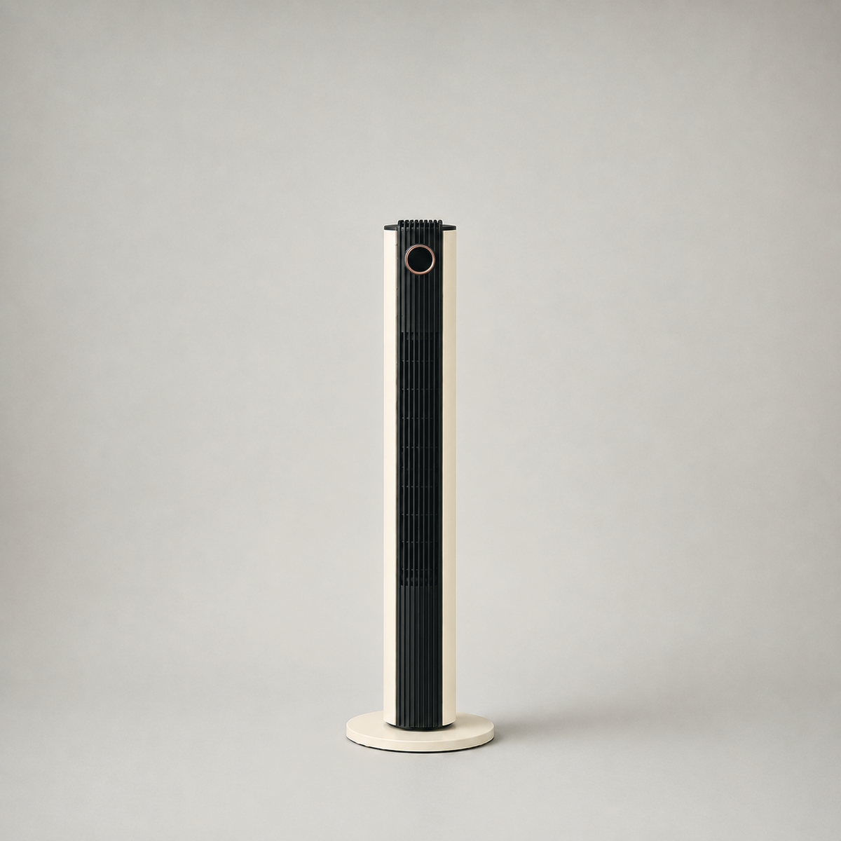 Cream tower fan photographed from the front on a plain grey background