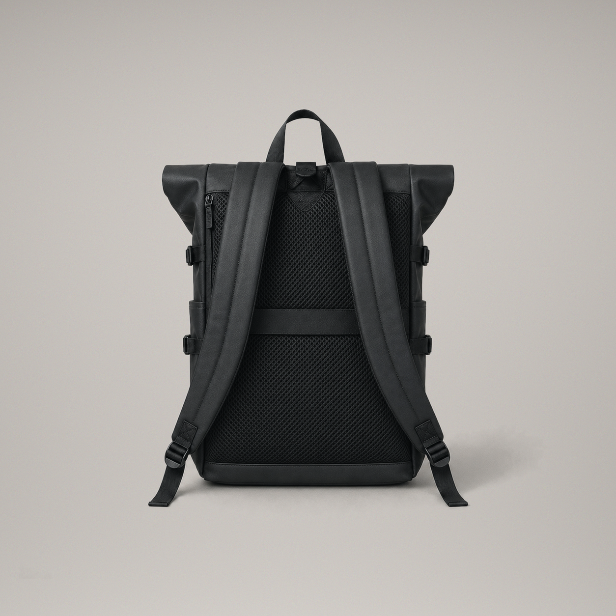 Studio rear view showing the diamond quilted mesh back panel, padded shoulder straps and luggage band