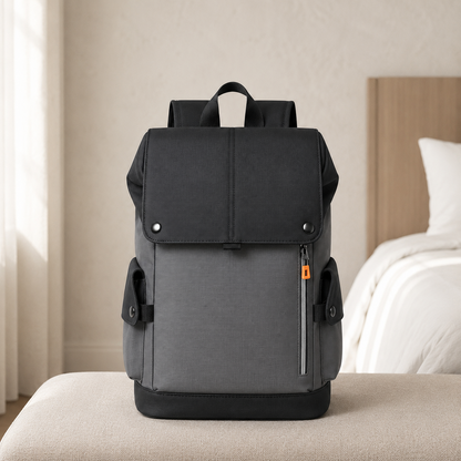 Black and gray business backpack on a bedroom bench in daylight