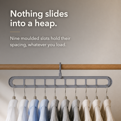Text over a closet photograph reading Nothing slides into a heap., with nine moulded slots holding hangers at even spacing