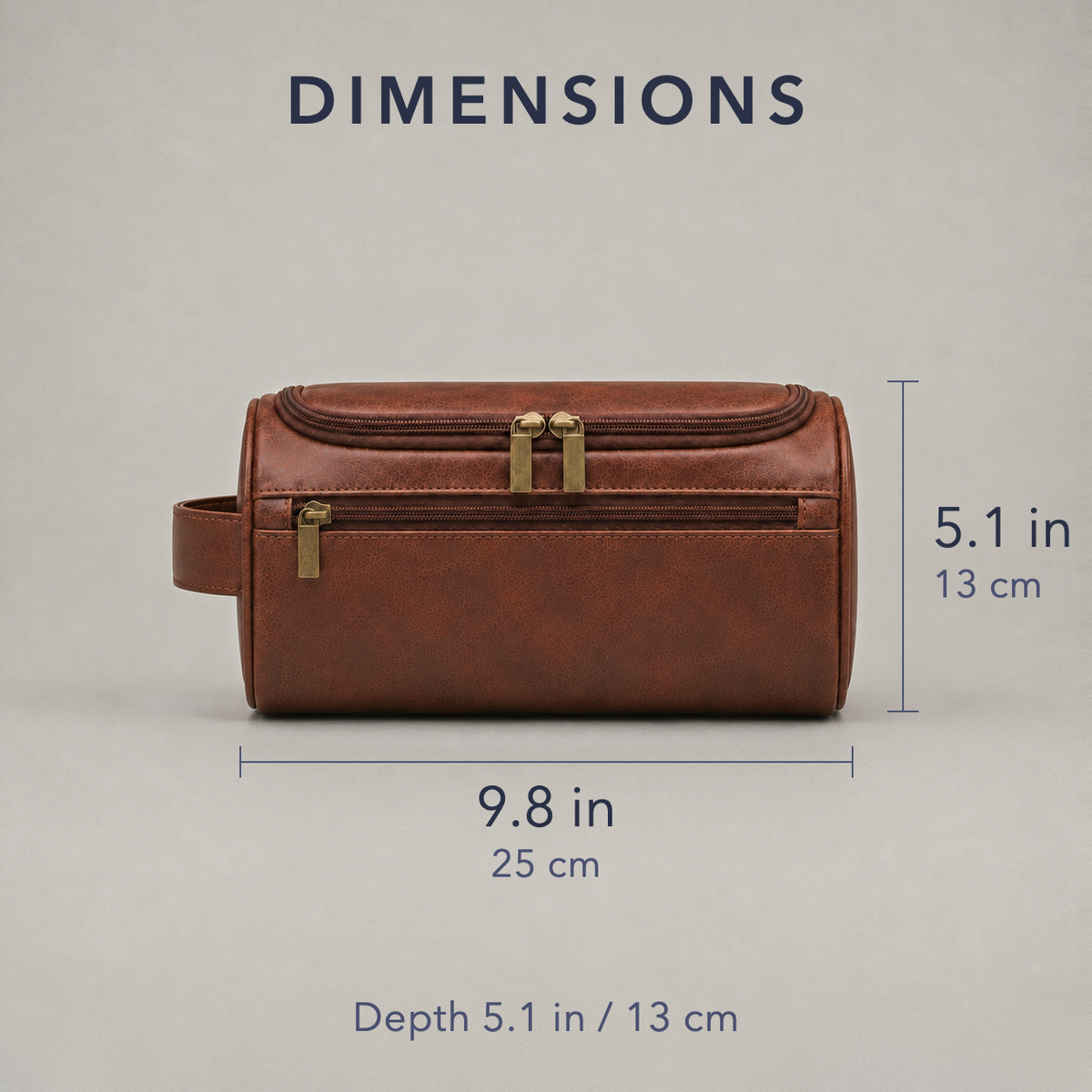 Dimension diagram of the toiletry bag seen flat from the front, 9.8 inches or 25 cm long and 5.1 inches or 13 cm tall, the strap handle on its left end, with a note reading depth 5.1 in / 13 cm