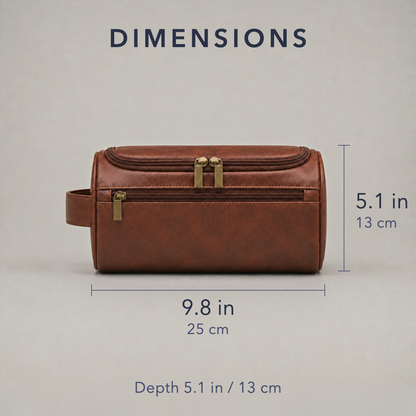 Dimension diagram of the toiletry bag seen flat from the front, 9.8 inches or 25 cm long and 5.1 inches or 13 cm tall, the strap handle on its left end, with a note reading depth 5.1 in / 13 cm
