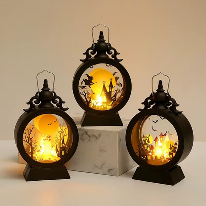 Three Halloween lanterns lit together at different heights, one turned to show the depth of the drum