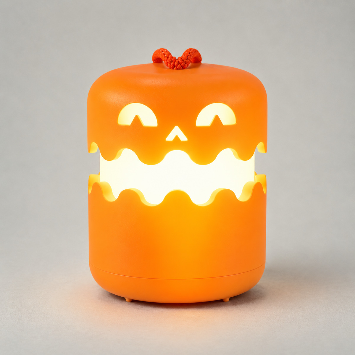 Pumpkin lantern open and lit, showing the band of light between its two halves
