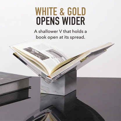 White and gold marble book stand holding an open book, under the words white and gold opens wider