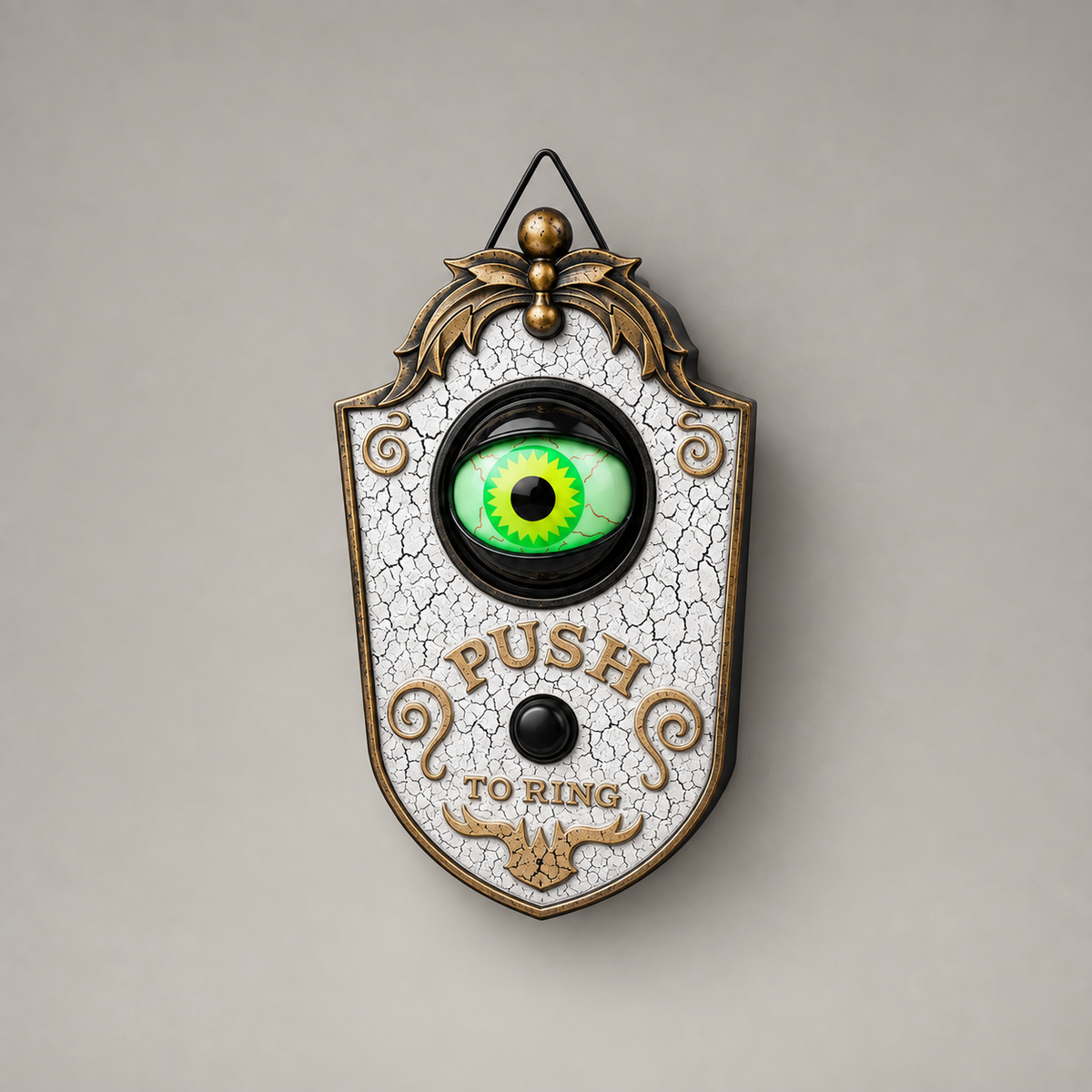 White Halloween eyeball doorbell decoration with a crackle finish, a black socket ring and a black button, photographed straight on against a plain grey background