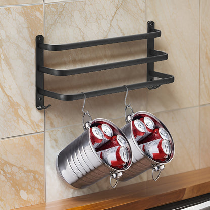 Three-bar matte black aluminum rack on a marble splashback, held by a plate at each end with a pair of small hooks under each plate, the bars stepping further out toward the bottom