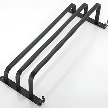 Three-bar matte black aluminum towel rack lying flat on white, each bar one continuous U between the two end plates, with a pair of small hooks at each plate