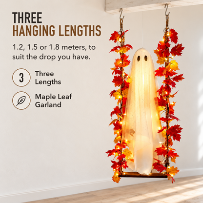 Ghost swing with maple leaf garland hanging against a pale hallway wall in daylight, with the words Three Hanging Lengths