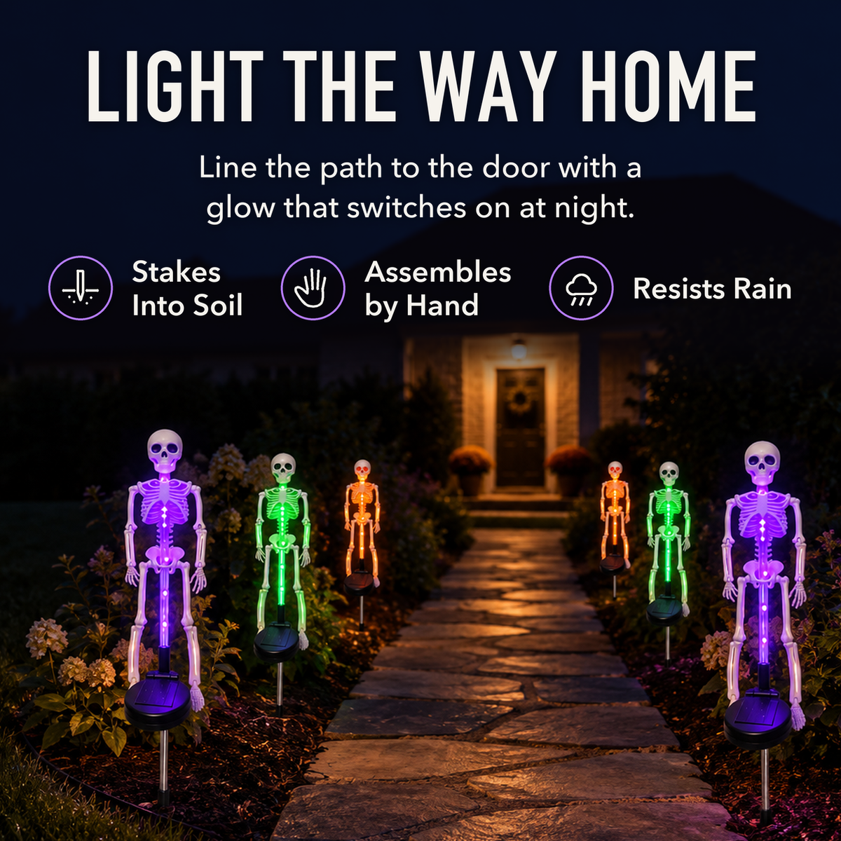 Six solar skeleton stake lights glowing purple, green and orange along a path to a lit front door at night, with the words Light the Way Home