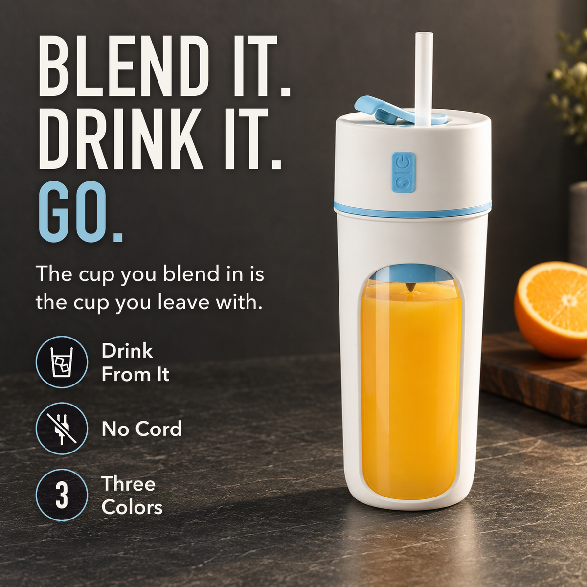 Portable blender cup with blue trim full of orange juice with a straw in its lid, on a dark kitchen counter, with the words Blend It. Drink It. Go.