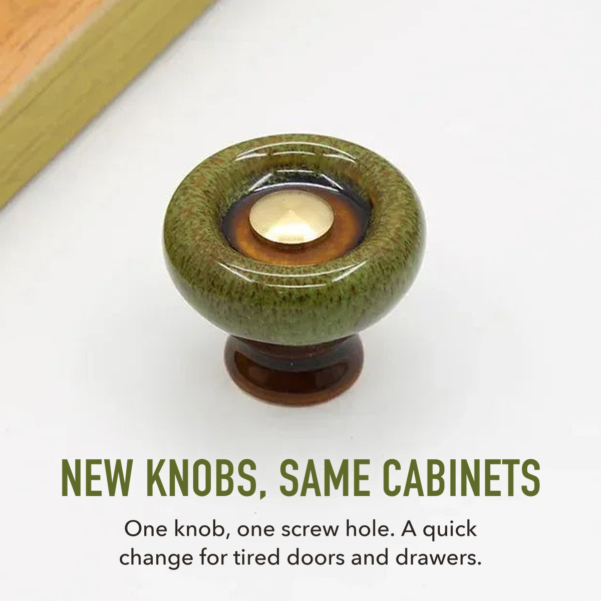 Green speckled ceramic cabinet knob with a gold-tone center, lettered new knobs, same cabinets