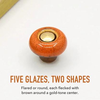 Orange speckled ceramic cabinet knob in the round style, lettered five glazes, two shapes