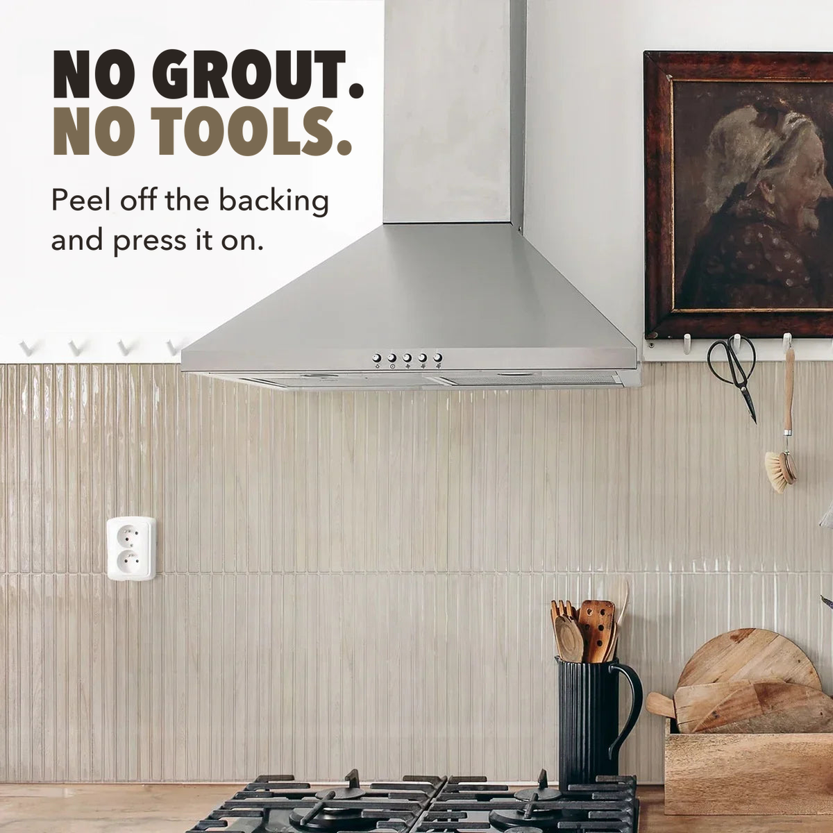 Peel and stick backsplash tiles behind a range hood, captioned no grout, no tools, peel off the backing and press it on