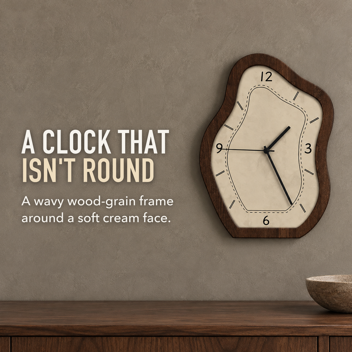 Text image: A clock that isn't round. A wavy wall clock with a wood-grain frame and cream face on a taupe dining room wall