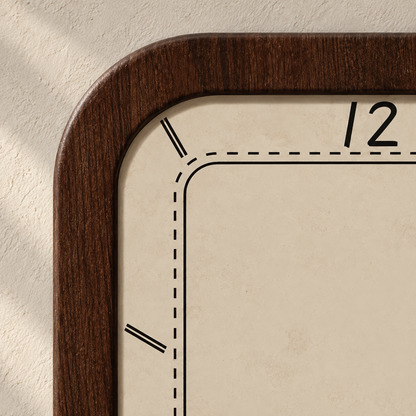 Close-up of the clock's corner: a wood-grain frame, a matte cream face, a stitched inner line, double-line hour markers and the 12