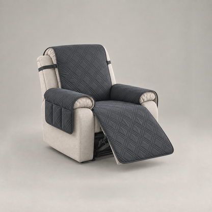 Black quilted recliner slipcover with a three-compartment arm pocket on a stone fabric recliner, footrest out, on a plain grey background