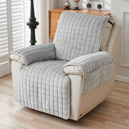 Gray grid quilted recliner cover with two arm covers on a cream leather recliner