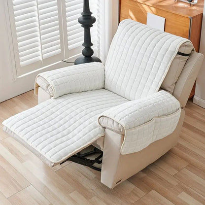 White quilted recliner cover on a reclined chair with the footrest raised and covered