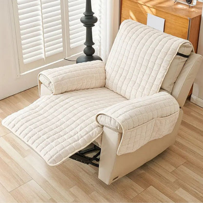 Beige quilted recliner cover on a reclined chair with the footrest raised and covered