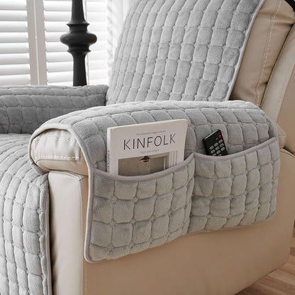 Gray quilted arm cover with a two-compartment pocket holding a magazine and a remote