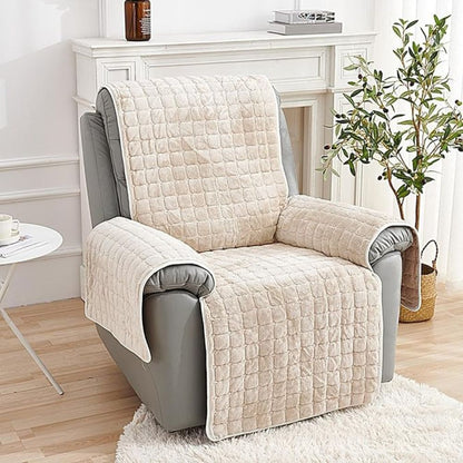 Beige grid quilted recliner cover on a gray leather recliner beside a white fireplace