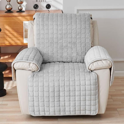 Gray grid quilted recliner cover seen from the front on a cream recliner