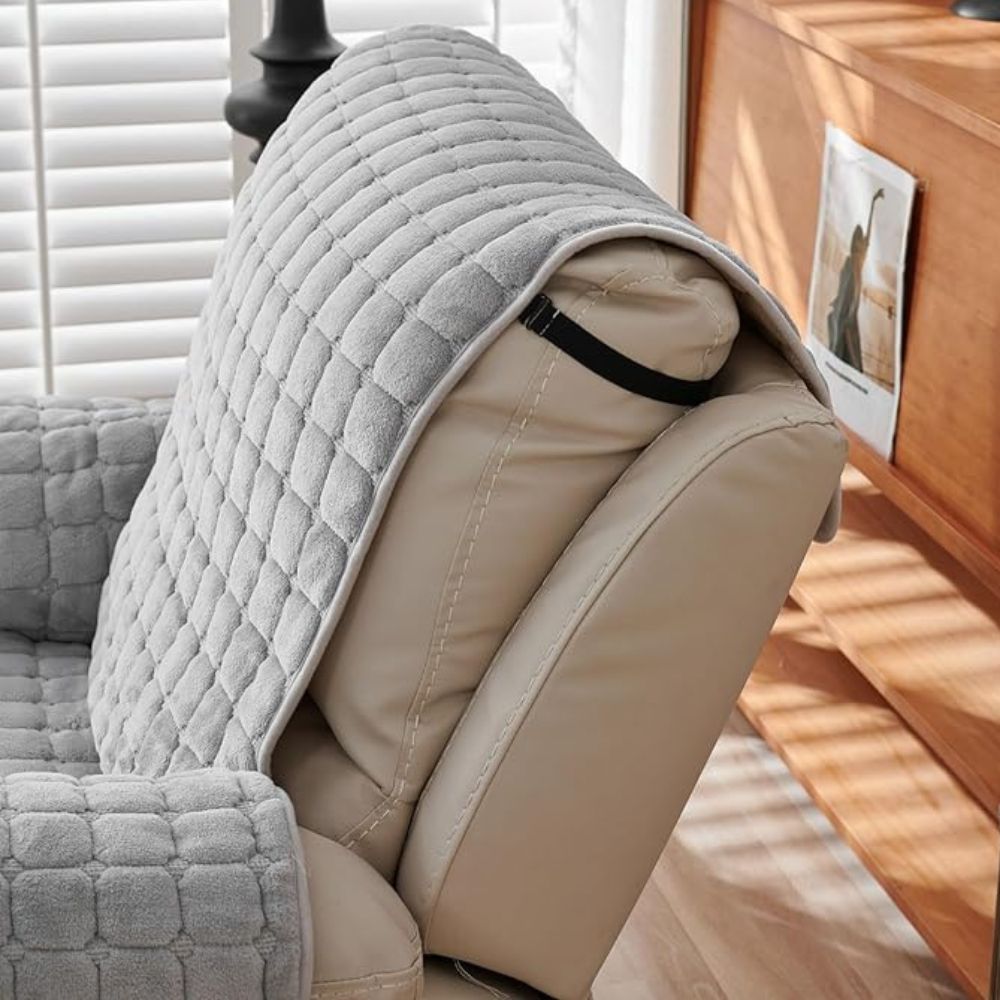 Back of the headrest showing the strap that holds the gray cover's top flap