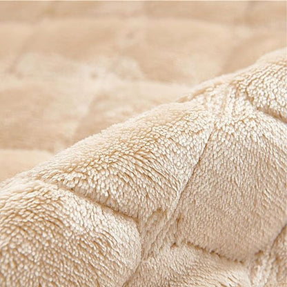 Close-up of the soft beige quilted pile of the recliner cover